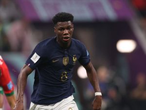 France's midfielder #08 Aurelien Tchouameni runs with the ball during the Qatar 2022 World Cup semi-final football match between France and Morocco at the Al-Bayt Stadium in Al Khor, north of Doha on December 14, 2022. (Photo by ADRIAN DENNIS / AFP)