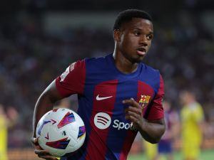 Barcelona's Spanish forward #10 Ansu Fati runs with the ball during the Spanish Liga football match between FC Barcelona and Cadiz CF at the Lluis Companys Olimpic Stadium in Barcelona on August 20, 2023. (Photo by LLUIS GENE / AFP)