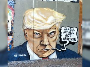 Popular Atlanta Muralist Chris Veal painted the Mug Shot mural