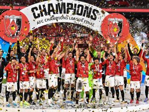 Urawa Red Diamonds players celebrate with the trophy after their victory against Al-Hilal in the second leg of the AFC Champions League final at Saitama Stadium in Saitama on May 6, 2023. (Photo by Philip FONG / AFP)