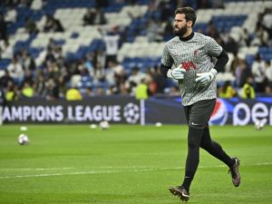 Liverpool's Brazilian goalkeeper Alisson Becker warms up ahead of the UEFA Champions League last 16 second leg football match between Real Madrid CF and Liverpool FC at the Santiago Bernabeu stadium in Madrid on March 15, 2023. (Photo by JAVIER SORIANO / AFP)