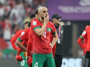 Morocco's midfielder #04 Sofyan Amrabat reacts to his team's defeat in the Qatar 2022 World Cup semi-final football match between France and Morocco at the Al-Bayt Stadium in Al Khor, north of Doha on December 14, 2022. (Photo by KARIM JAAFAR / AFP)