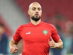 Morocco's midfielder #04 Sofyan Amrabat warms up before the Qatar 2022 World Cup quarter-final football match between Morocco and Portugal at the Al-Thumama Stadium in Doha on December 10, 2022. (Photo by KARIM JAAFAR / AFP)