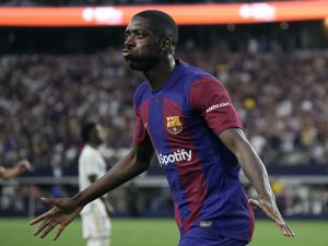 Ousmane Dembélé #7 of FC Barcelona celebrates after scoring a goal during the first half of a pre-season friendly match against Real Madrid at AT&T Stadium on July 29, 2023 in Arlington, Texas. Sam Hodde/Getty Images/AFP (Photo by Sam Hodde / GETTY IMAGES NORTH AMERICA / Getty Images via AFP)