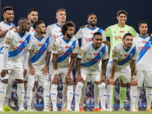 Hilal's players pose for a group picture at the start of the Saudi Pro League football match between Al-Hilal and Al-Raed at the King Abdullah Stadium in Buraydah on August 24, 2023. (Photo by AFP)