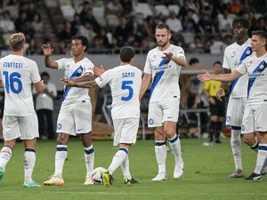 Members of Inter Milan celebrate after teammate Italian forward Sebastiano Esposito (not pictured) scored the equaliser during the football friendly match between Italy's Inter Milan and France's Paris Saint-Germain (PSG) at the National Stadium in Tokyo on August 1, 2023. (Photo by Richard A. Brooks / AFP)