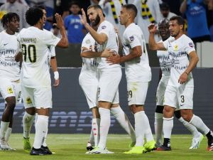 Ittihad's French forward Karim Benzema (C) celebrates with teammates after scoring his team's second goal during the 2023 Arab Club Champions Cup group A football match between Tunisia's Esperance de Tunis and Saudi Arabia's Al-Ittihad at the King Fahd Stadium in Taif on July 27, 2023. (Photo by AFP)