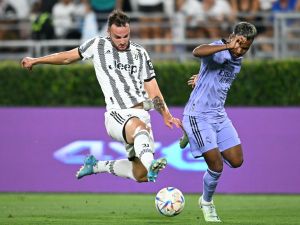 Juventus' Italian defender Frederico Gatti (L) and Real Madrid's Brazilian forward Rodrygo vie for the ball during the international friendly football match between Real Madrid and Juventus at the Rose Bowl in Pasadena, California, on July 30, 2022. (Photo by Robyn Beck / AFP)