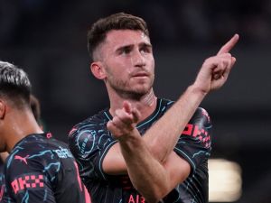 Manchester City defender Aymeric Laporte (R) reacts after his goal during the International friendly football match between Bayern Munich of Germany and Manchester City of England at the National Stadium in Tokyo on July 26, 2023. (Photo by Kazuhiro NOGI / AFP)