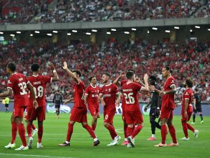 Liverpool's Dutch defender Virgil van Dijk (2nd R) celebrates with teammates after scoring a goal against Bayern Munich during the Singapore Festival of Football pre-season friendly match in Singapore on August 2, 2023. (Photo by MOHD RASFAN / AFP)