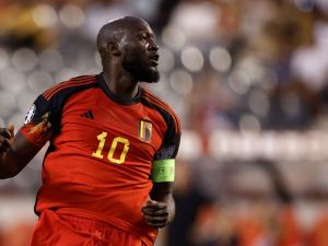 Belgium's forward Romelu Lukaku scores the team's first goal during the UEFA Euro 2024 group F qualification football match between Belgium and Austria at the King Baudouin Stadium in Brussels, on June 17, 2023. (Photo by KENZO TRIBOUILLARD / AFP)
