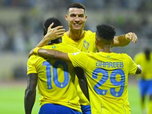 Nassr's Senegalese Forward #10 Sadio Mane, Nassr's Portuguese forward #07 Cristiano Ronaldo and Nassr's Saudi midfielder #29 Abdulrahman Ghareeb celebrate a goal during the Saudi Pro League football match between Al-Nassr and Al-Fateh at the Prince Abdullah Bin Jalawi Stadium in al-Hasa, on August 25, 2023. (Photo by Ali Al-HAJI / AFP)