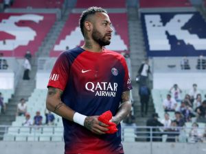 Paris Saint-Germain's Neymar Jr looks on as he enters the stadium before the friendly football match between France's Paris Saint-Germain and Saudi Arabia's Al-Nassr at Nagai Stadium in Osaka on July 25, 2023. (Photo by PAUL MILLER / AFP)