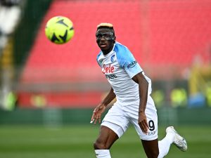Napoli's Nigerian forward Victor Osimhen runs with the ball during the Italian Serie A football match between Monza and Napoli on May 14, 2023 at the Brianteo stadium in Monza. (Photo by GABRIEL BOUYS / AFP)