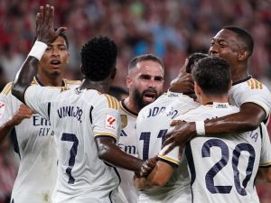 Real Madrid's Brazilian forward #11 Rodrygo celebrates scoring the opening goal during the Spanish Liga football match between Athletic Bilbao and Real Madrid at the San Mames stadium in Bilbao on August 12, 2023. (Photo by CESAR MANSO / AFP)