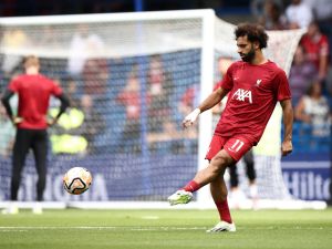 Liverpool's Egyptian striker #11 Mohamed Salah warms up ahead of the English Premier League football match between Chelsea and Liverpool at Stamford Bridge in London on August 13, 2023. (Photo by HENRY NICHOLLS / AFP)