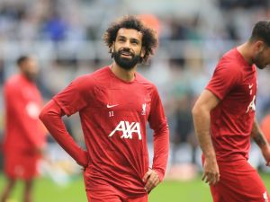 Liverpool's Egyptian striker #11 Mohamed Salah warms-up during the English Premier League football match between Newcastle United and Liverpool at St James' Park in Newcastle-upon-Tyne, north east England on August 27, 2023. (Photo by Lindsey Parnaby / AFP)