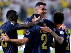 Nassr's Saudi defender #02 Sultan al-Ghanam (C) celebrates his goal with his teammates during the Saudi Pro League football match between Al-Nassr and Al-Shabab in Riyadh's Al-Awal Park Stadium on August 29, 2023. (Photo by Fayez NURELDINE / AFP)