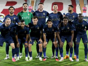 Nassr team players pose for a group picture during the AFC Champions League group E football match between Persepolis FC and al-Nassr FC at Tehran's Azadi stadium, on September 19, 2023. (Photo by ATTA KENARE / AFP)