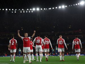 Arsenal's Norwegian midfielder #08 Martin Odegaard celebrates scoring the team's fourth goal during the UEFA Champions League Group B football match between Arsenal and PSV Eindhoven at the Arsenal Stadium in north London on September 20, 2023. (Photo by Adrian DENNIS / AFP)
