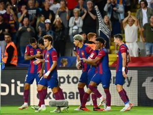 Barcelona's Portuguese defender #02 Joao Cancelo celebrates with teammates after scoring his team's third goal during the Spanish Liga football match between FC Barcelona and RC Celta de Vigo at the at the Estadi Olimpic Lluis Companys in Barcelona on September 23, 2023. (Photo by Pau BARRENA / AFP)