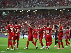 Liverpool's Dutch defender Virgil van Dijk (2nd R) celebrates with teammates after scoring a goal against Bayern Munich during the Singapore Festival of Football pre-season friendly match in Singapore on August 2, 2023. (Photo by MOHD RASFAN / AFP)
