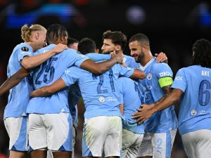 Manchester City's Argentinian striker #19 Julian Alvarez celebrates with teammates after scoring his team second goal during the UEFA Champions League Group G football match between Manchester City and FC Crvena Zvezda (Red Star Belgrade) at the Etihad Stadium in Manchester, north west England, on September 19, 2023. (Photo by Oli SCARFF / AFP)
