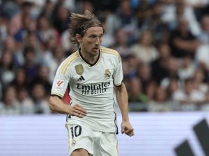 Real Madrid's Croatian midfielder #10 Luka Modric runs with the ball during the Spanish Liga football match between Real Madrid CF and Getafe CF at the Santiago Bernabeu stadium in Madrid on September 2, 2023. (Photo by Thomas COEX / AFP)