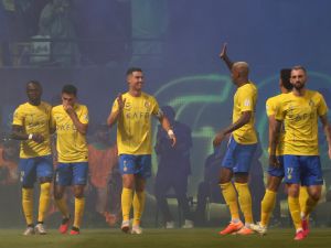 Nassr's players celebrate scoring during the Saudi Pro League football match between Al-Nassr and Al-Ahli at the King Saud University Stadium in Riyadh, on September 22, 2023. (Photo by Fayez NURELDINE / AFP)