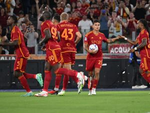 Roma's Argentine forward #21 Paulo Dybala (2R) celebrates with his teammates after scoring his team's first goal during the Italian Serie A football match between AS Roma and Empoli at the Olympic stadium in Rome on September 17, 2023. (Photo by Andreas SOLARO / AFP)