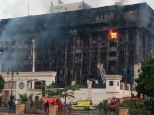 Firefighters try to extinguish a fire at a police headquarters in Ismailia on October 2, 2023. A huge fire broke out at the police headquarters in the Egyptian city of Ismailia on October 2, injuring at least 25 people, according to security sources. (Photo by AFP) Ismailia police directorate