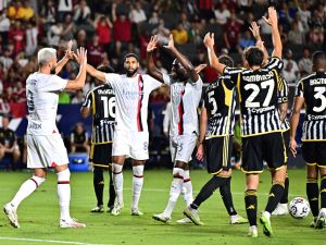 AC Milan's French forward Olivier Giroud (L) celebrates scoring his team's second goal during a pre-season friendly football match between Juventus FC and AC Milan at Dignity Health Sports Park in Carson, California, on July 27, 2023. (Photo by Frederic J. BROWN / AFP)