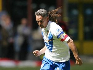Brescia's captain Roberto Baggio kicks the ball during their Italian Serie A football match against AC Milan at San Siro stadium in Milan, 16 May 2004. For the season's last match, AC Milan celebrates its Italy's 17th champions title as Brescia's Roberto Baggio plays his final match before hanging up his boots. AFP PHOTO/Carlo BARONCINI (Photo by CARLO BARONCINI / AFP)