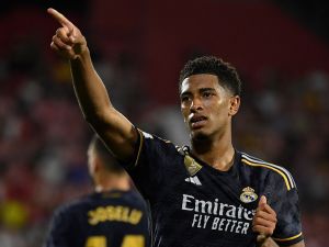Real Madrid's English midfielder #5 Jude Bellingham celebrates after scoring his team's third goal during the Spanish Liga football match between Girona FC and Real Madrid CF at the Montilivi stadium in Girona on September 30, 2023. (Photo by Josep LAGO / AFP)