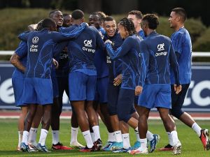 France's forward Kylian Mbappe (C) reacts during a training session in Clairefontaine-en-Yvelines on October 10, 2023 as part of the team's preparation for upcoming UEFA Euro 2024 football tournament qualifying matches. France will play against Netherlands in the Group B of Euro 2024 qualifiers. (Photo by FRANCK FIFE / AFP)