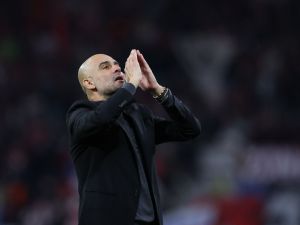 Manchester City's Spanish manager Pep Guardiola blows kisses after the UEFA Champions League Group G football match between RB Leipzig and Manchester City in Leipzig, eastern Germany on October 4, 2023. (Photo by Ronny HARTMANN / AFP)