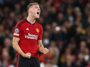 Manchester United's Danish striker #11 Rasmus Hojlund celebrates scoring the opening goal during the UEFA Champions league group A football match between Manchester United and Galatasaray at Old Trafford stadium in Manchester, north west England, on October 3, 2023. (Photo by Darren Staples / AFP)