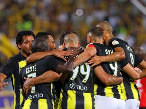 Ittihad's Moroccan forward #99 Abderrazak Hamdallah celebrates after scoring the third goal during the Saudi Pro League football match between Al-Ittihad and Al-Riyadh at the Prince Faisal Bin Fahd stadium in Riyadh on August 24, 2023. (Photo by Fayez NURELDINE / AFP)