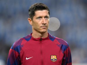 Barcelona's Polish forward #09 Robert Lewandowski looks on before the start of the UEFA Champions League 1st round day 2 group H football match between FC Porto and FC Barcelona at the Dragao stadium in Porto on October 4, 2023. (Photo by Patricia DE MELO MOREIRA / AFP)