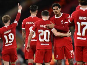 Liverpool's Portuguese striker #20 Diogo Jota (C) celebrates with teammates after scoring their second goal during the UEFA Europa League group E football match between Liverpool and Royale Union Saint-Gilloise at Anfield in Liverpool, north west England on October 5, 2023. Liverpool won the game 2-0. (Photo by Oli SCARFF / AFP)