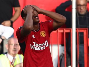 Manchester United's French striker #09 Anthony Martial reacts after missing a late chance during the English Premier League football match between Manchester United and Brentford at Old Trafford in Manchester, north west England, on October 7, 2023. (Photo by Darren Staples / AFP) 