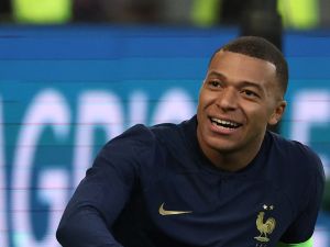 France's forward #10 Kylian Mbappe reacts after missing a goal opportunity during the friendly football match between France and Scotland at Pierre-Mauroy stadium, in Villeneuve-D'Ascq, northern France, on October 17, 2023. (Photo by FRANCK FIFE / AFP)