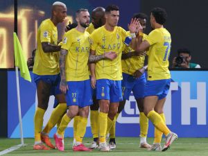 Nassr's Portuguese forward #07 Cristiano Ronaldo celebrates with teammates after their third goal during the AFC Champions League group E football match between Saudi al-Nassr SC and Tajikistan's FC Istiklol at King Saud University Stadium in Riyadh on October 2, 2023. (Photo by Fayez NURELDINE / AFP)