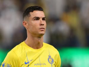 Nassr's Portuguese forward #07 Cristiano Ronaldo stands in line for the national anthems ahead of the Saudi Pro League football match between Al-Nassr and Abha at the King Saud University Stadium in Riyadh on October 6, 2023. (Photo by Fayez NURELDINE / AFP)