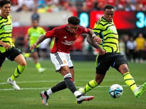 Manchester United's English midfielder Jadon Sancho (C) shoots the ball to score his team's first goal during the friendly football match between Manchester United and Arsenal at MetLife Stadium in East Rutherford, New Jersey, on July 22, 2023. (Photo by Leonardo Munoz / AFP)