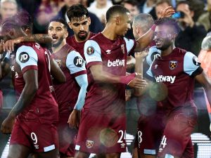 West Ham United's Ghanaian midfielder #14 Mohammed Kudus celebrates with teammates after scoring a second goal during the UEFA Europa League group A football match between West Ham United and Backa Topola at The London Stadium in east London on September 21, 2023. (Photo by HENRY NICHOLLS / AFP)