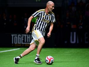 Juventus' former French player Zinedine Zidane plays a football match during the "Together, a Black & White Show" event, the first Juventus party dedicated to all its fans, at the Pala Alpitour in Turin, on October 10, 2023. (Photo by MARCO BERTORELLO / AFP)