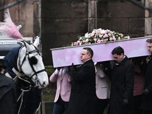 The coffin of murdered transgender teenager Brianna Ghey, is carried outside St Elphin's Church in Warrington, northern England. (Oli Scarff/ AFP)