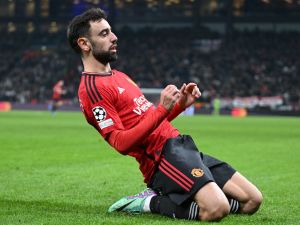 Manchester United's Portuguese midfielder #08 Bruno Fernandes celebrates after scoring the 2-3 from a penalty kick during the UEFA Champions League Group A football match between FC Copenhagen and Manchester United FC in Copenhagen, Denmark on November 8, 2023. (Photo by Jonathan NACKSTRAND / AFP)