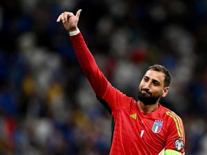 Italy's goalkeeper #01 Gianluigi Donnarumma celebrates after winning during the Euro 2024 football tournament group C qualifying match between Italy and Ukraine, at Stadio San Siro in Milan, on September 12, 2023. (Photo by GABRIEL BOUYS / AFP)